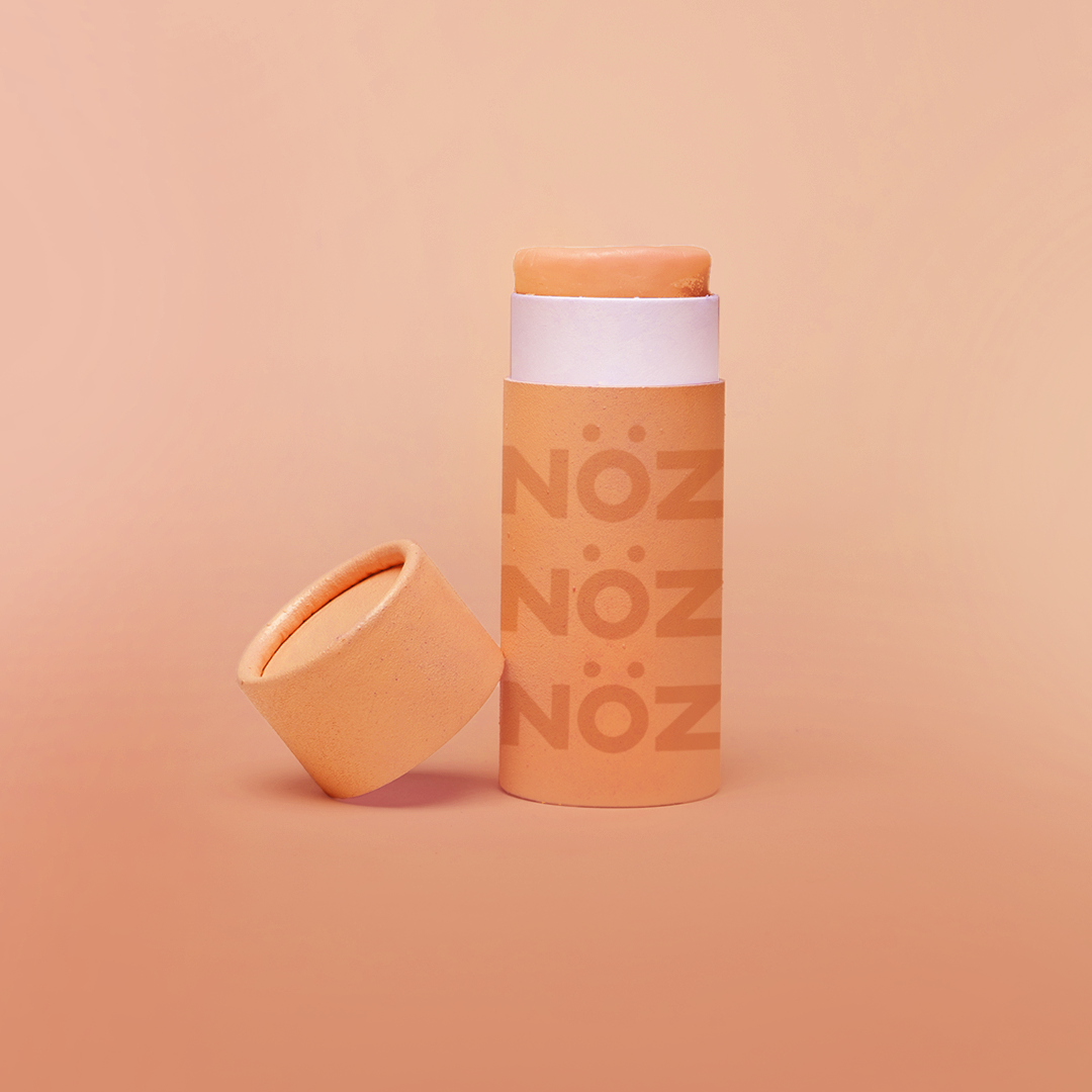 NOZ sunscreen product in color neon orange